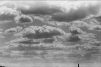 a black and white photo of a cloudy sky